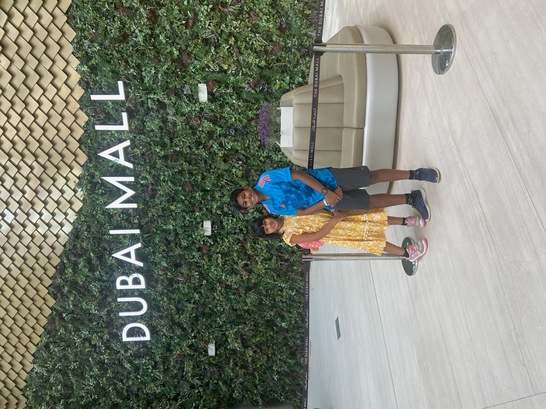 This is a photo of me and my sister at the Dubai Mall.