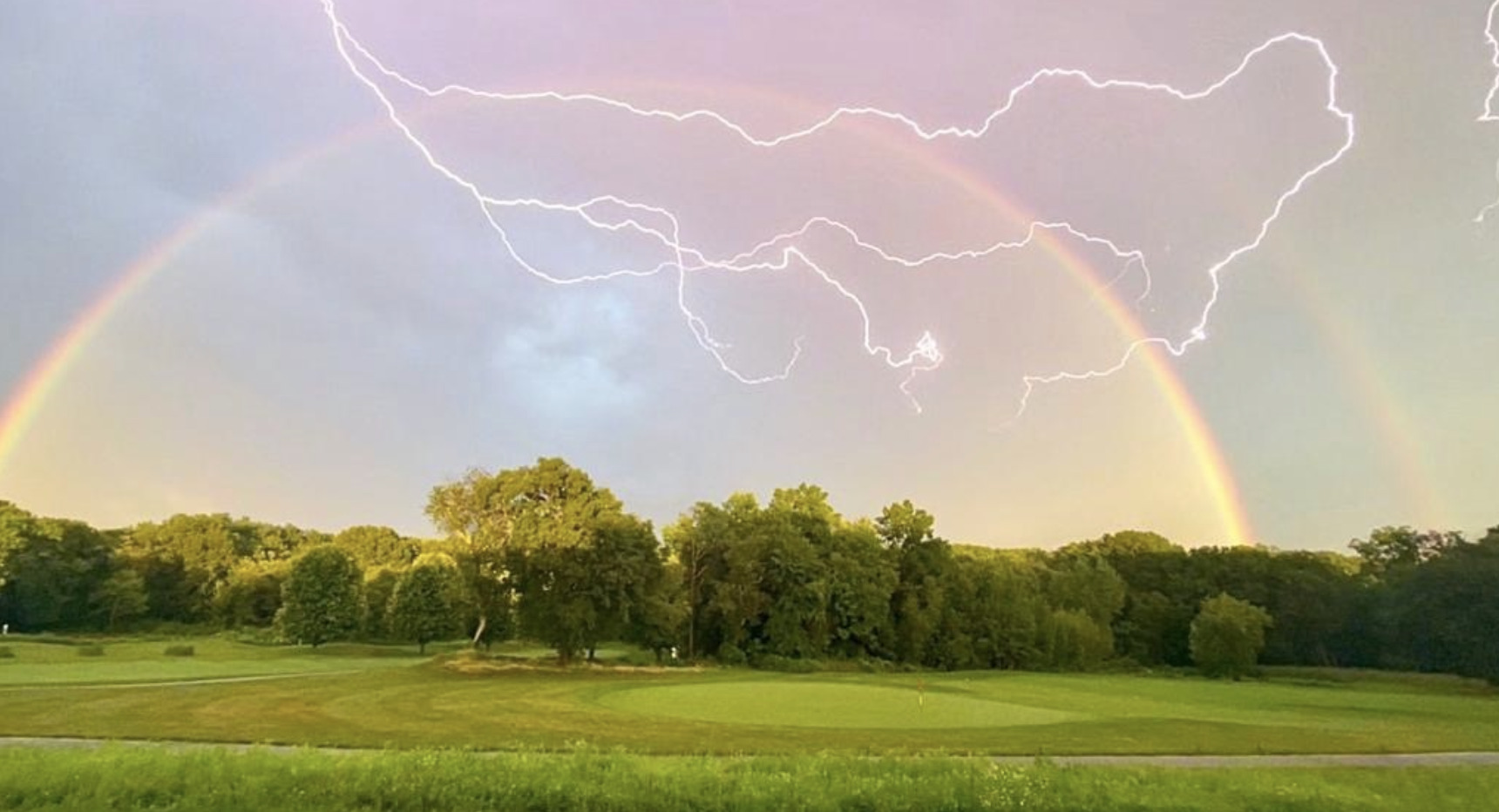 Double rainbow with lightning