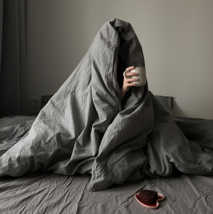 Person wrapped in a blanket
