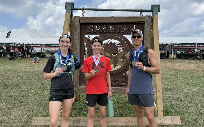 A picture of my father, brother, and I after our first spartan race.