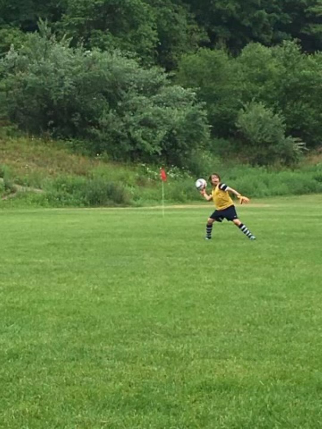 Little Kid playing soccer