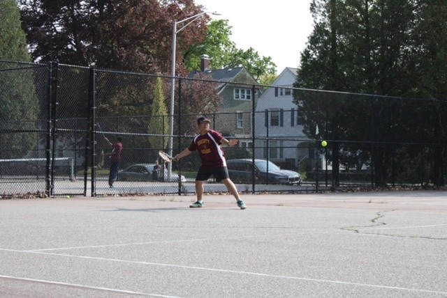 9th grader Evan hitting a forehead during a match