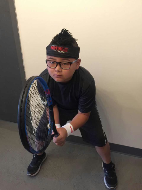 Ten-year old Evan with his new racket