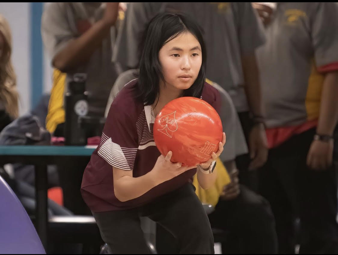 Me holding a bowling ball, about to throw it.