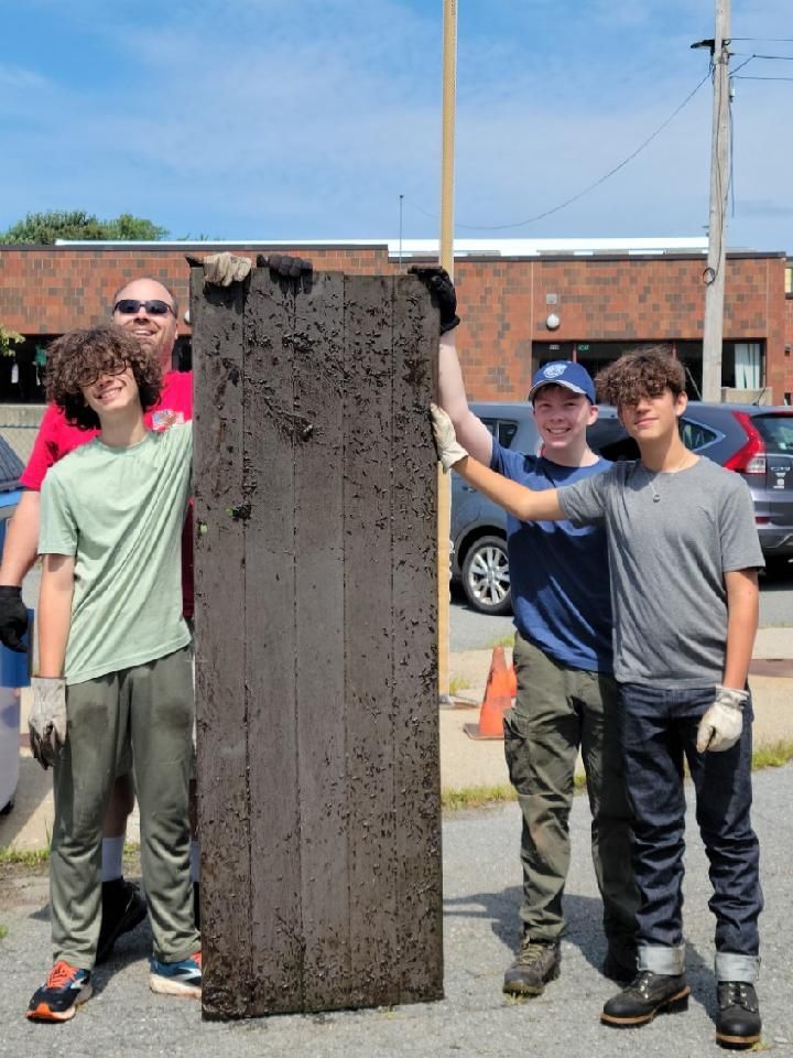 A photo of me and two of my friends from
		Scouts after finding a large piece of wood-plastic composite in the water