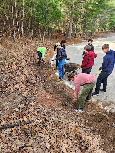 A photo of people clearing the pathway for Eagle Project