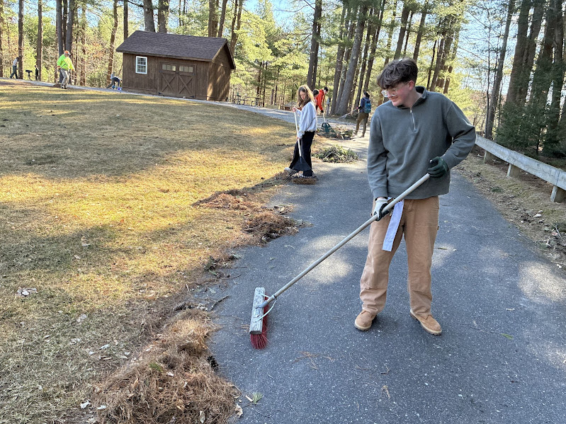 A photo of people clearing a different trail at Buffumville Dam for Earth Day
