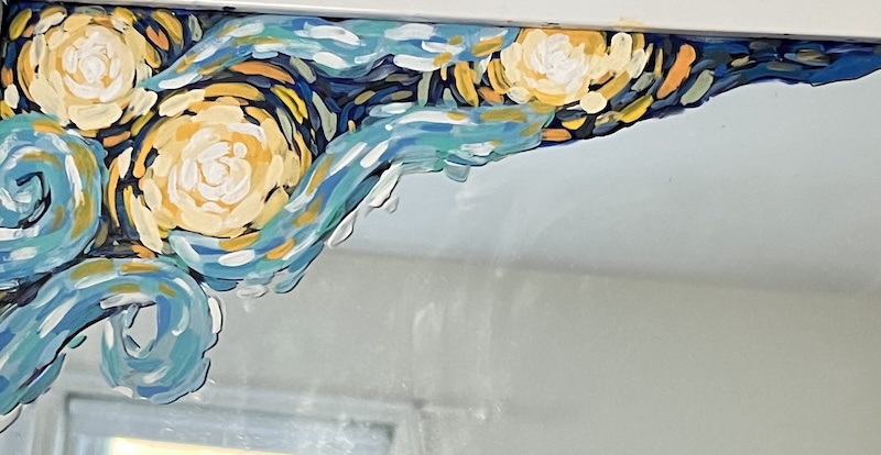 blue and yellow swirls painted on mirror