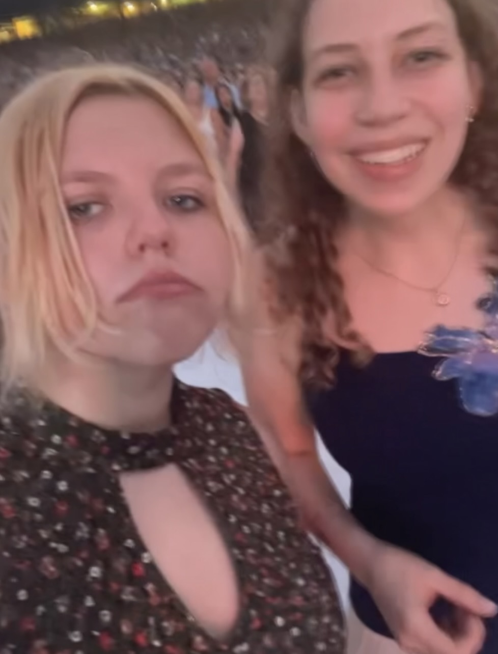 =Two girls posing for camera
