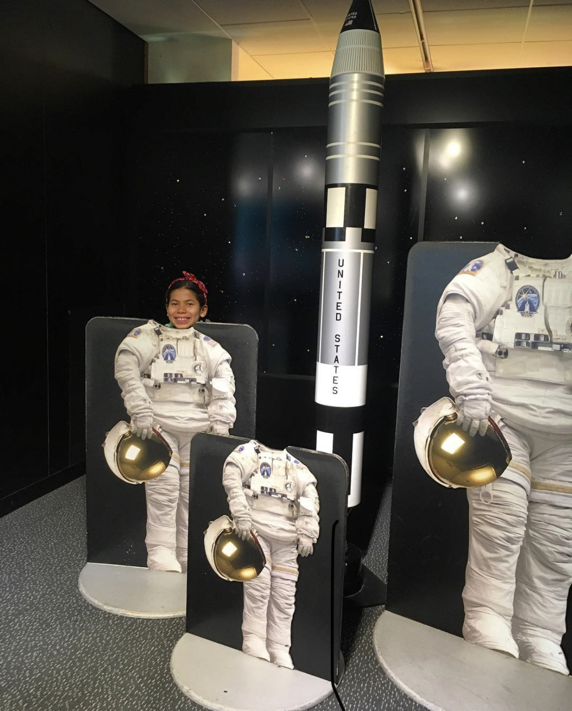 kayla standing behind astronaut cutout