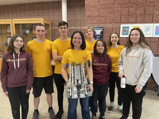 Marianapolis Robotics Team posing with their competition robot.