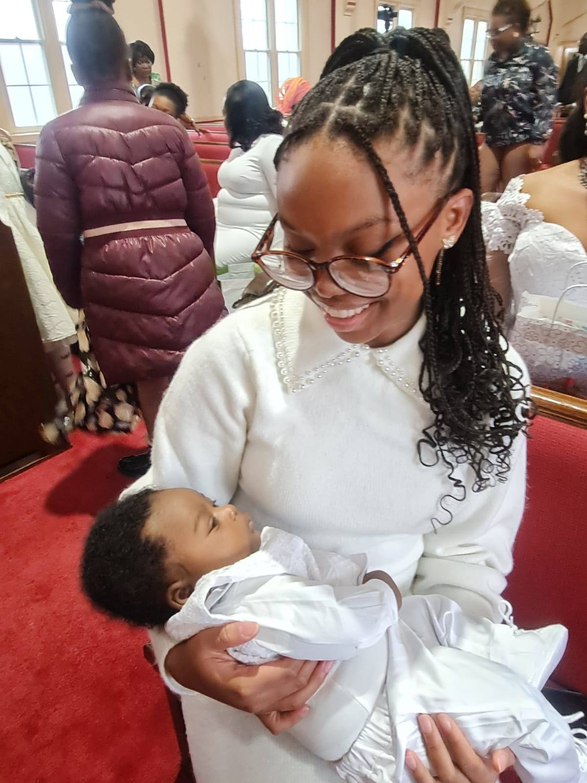 A photo me holding a baby at church. 