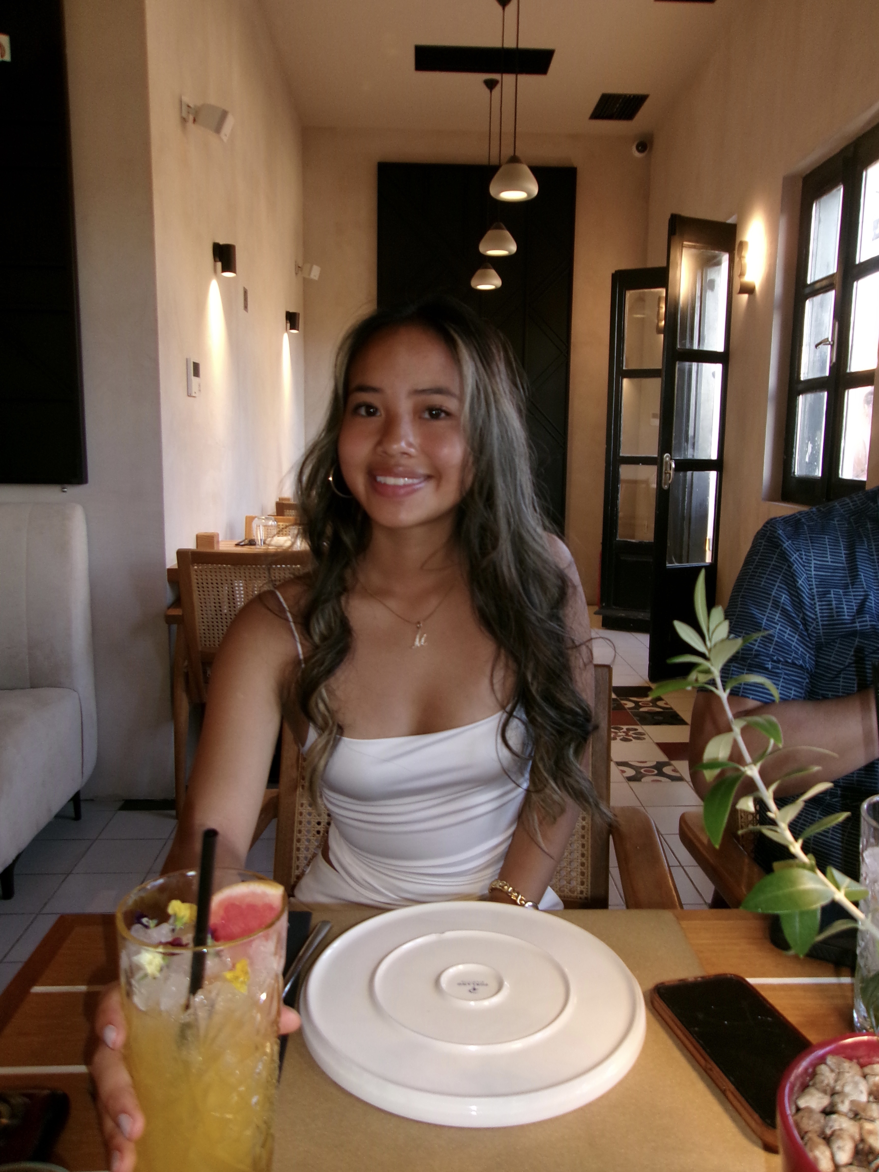 Smiley girl sitting at a restaurant