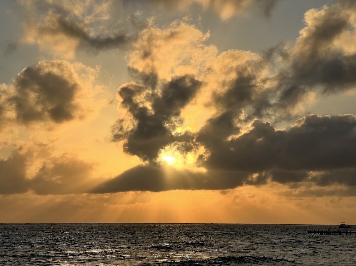 Picture of sun shining through the clouds