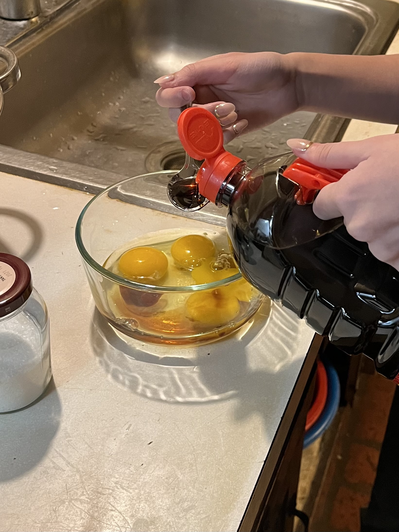 Pouring Soy Sauce into Egg Mixture