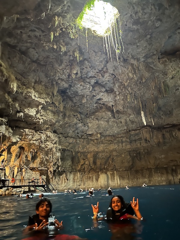 My sister and I in a cave swimming.