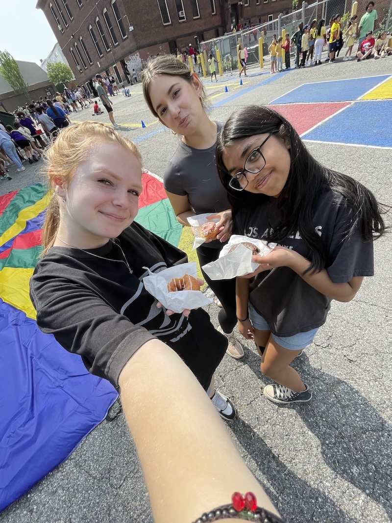 Me and friends eating donuts during a volunteering event!