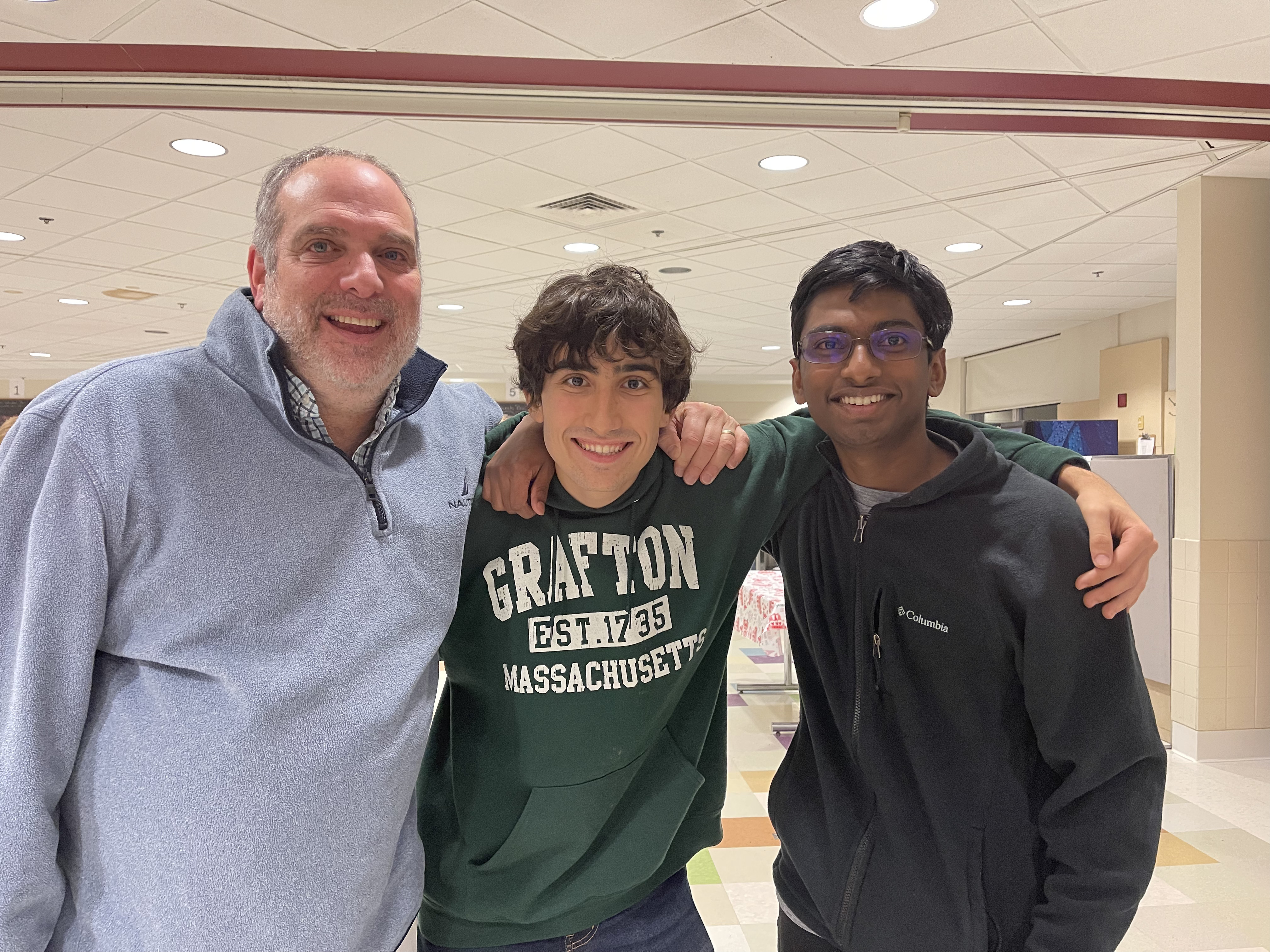 A picture of vik, Christian and Mr. Koss who together founded the Grafton middle school math team